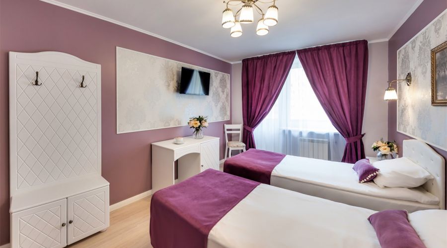 Улучшенный номер с двумя раздельными кроватями или одной двуспальной кроватью