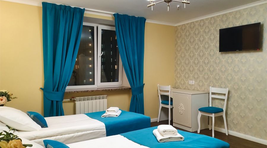 Улучшенный номер с двумя раздельными кроватями или одной двуспальной кроватью